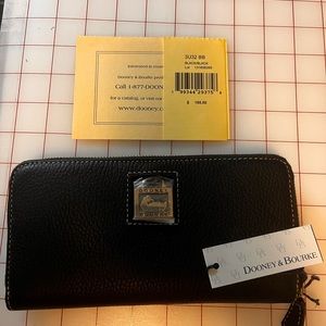 Dooney & Bourke wallet.  Black   New with tag. Measures 8” by 4”